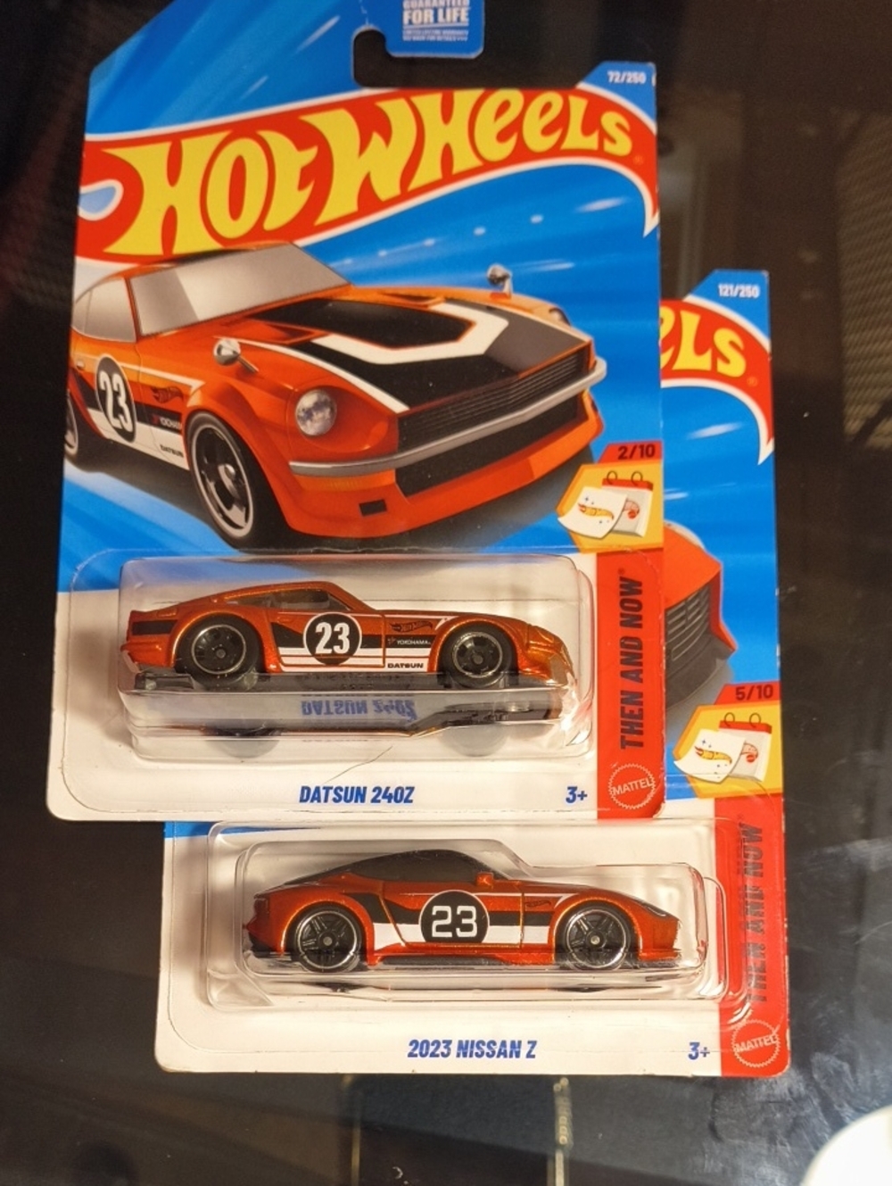 Hot Wheels Then And Now 2 And 5 Of 10Orange Datsun 240Z and Nissan 23 Z